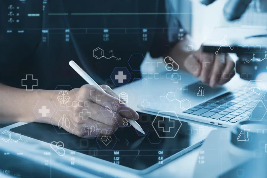 Health-Conditions-Treated-Doctor Close-up of a medical professional using a laptop and tablet, with illustrated medical symbols overlayed on the image, symbolizing health conditions treated by Anita Petruzzelli, M.D. in Glastonbury.