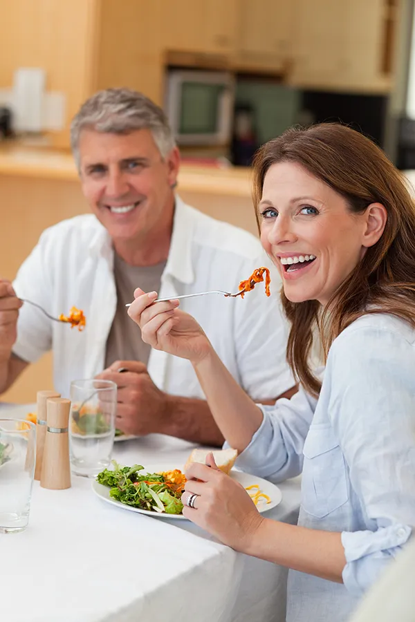 Micronutrient-Testing-Treatments A middle-aged couple eat a healthy meal. Get micronutrient testing from Anita Petruzzelli, M.D. in Glastonbury.