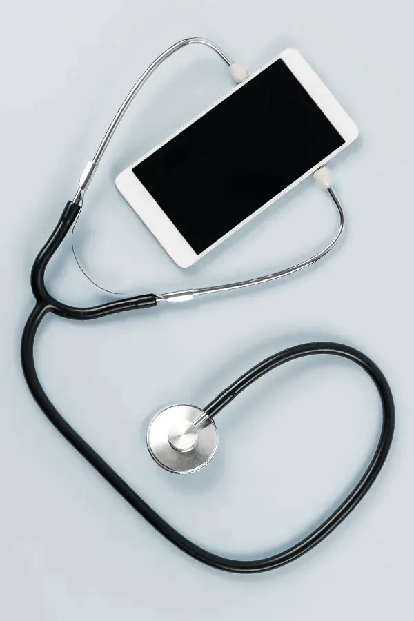 Telemedicine-Treatment A smartphone with a stethoscope attached to it, symbolizing Telemedicine treatment from Anita Petruzzelli, M.D. in Glastonbury.